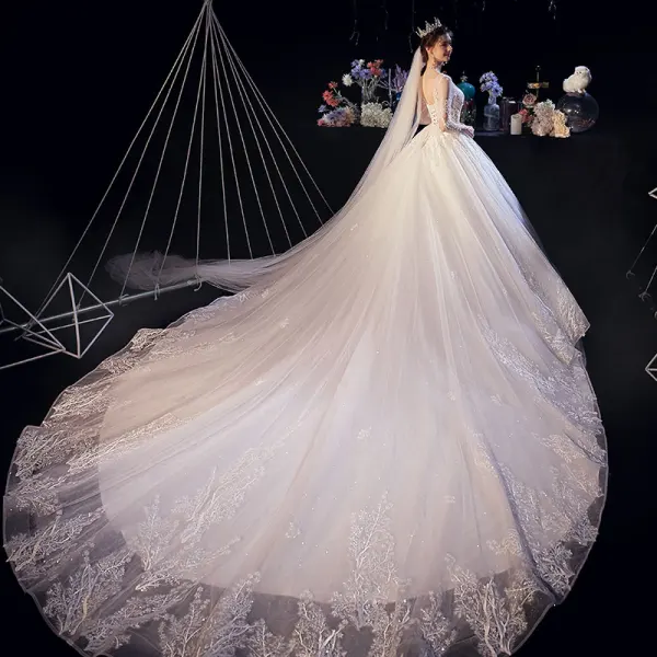 Illusion Ivoire Transparentes Robe De Mariée 2020 Princesse Encolure Dégagée 3/4 Manches Dos Nu Glitter Tulle Appliques En Dentelle Perlage Cathedral Train Volants