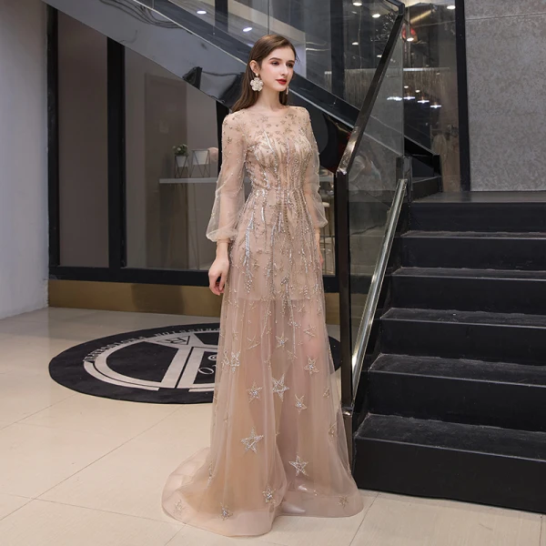 Haut de Gamme Doré Transparentes Robe De Soirée 2020 Princesse Encolure Dégagée Gonflée Manches Longues Étoile Perlage Faux Diamant Train De Balayage Volants Robe De Ceremonie