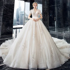 Luxury Gorgeous Champagne Wedding Dresses 2020 Ball Gown V Neck Short Sleeve Backless Glitter Tulle Appliques Lace Beading Cathedral Train Ruffle