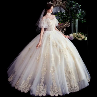 Best Champagne Outdoor Garden Wedding Dresses 2020 Ball Gown Off The Shoulder Short Sleeve Backless Appliques Lace Beading Floor Length Long Ruffle