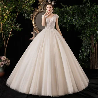 Meilleur Champagne Jardin Extérieur Robe De Mariée 2020 Robe Boule Col V Profond Manches Courtes Dos Nu Glitter Tulle Perlage Longue