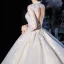 Illusion Champagne Transparentes Robe De Mariée 2020 Robe Boule V-Cou 3/4 Manches Dos Nu Appliques En Dentelle Perlage Cathedral Train Volants