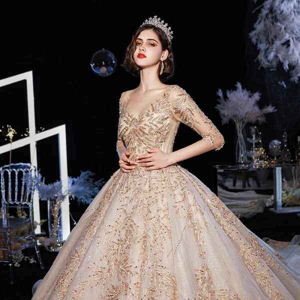 Luxe Champagne Robe De Mariée 2020 Robe Boule Transparentes Encolure Dégagée 3/4 Manches Dos Nu Glitter Tulle Appliques En Dentelle Perlage Cathedral Train Volants