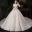 Chic / Belle Champagne Transparentes Robe De Mariée 2020 Robe Boule Encolure Dégagée Sans Manches Dos Nu Appliques En Dentelle Perlage Glitter Tulle Cathedral Train Volants