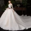Chic / Belle Champagne Transparentes Robe De Mariée 2020 Robe Boule Encolure Dégagée Sans Manches Dos Nu Appliques En Dentelle Perlage Glitter Tulle Cathedral Train Volants
