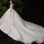 Chic / Belle Champagne Transparentes Robe De Mariée 2020 Robe Boule Encolure Dégagée Sans Manches Dos Nu Appliques En Dentelle Perlage Glitter Tulle Cathedral Train Volants