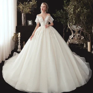 Victorian Style Champagne See Through Wedding Dresses 2020 Ball Gown V Neck Puffy Short Sleeve Backless Glitter Tulle Appliques Lace Beading Chapel Train Ruffle