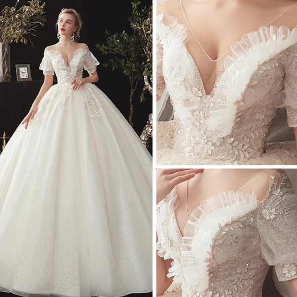 Style Victorien Champagne Transparentes Robe De Mariée 2020 Robe Boule V-Cou Gonflée Manches Courtes Dos Nu Glitter Tulle Appliques En Dentelle Perlage Chapel Train Volants