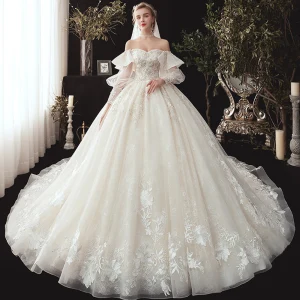 Style Victorien Champagne Robe De Mariée 2020 Robe Boule De L Épaule Gonflée Manches Longues Dos Nu Glitter Tulle Appliques En Dentelle Perlage Chapel Train Volants