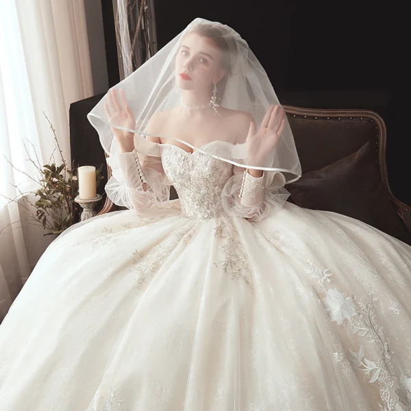 Victorian Style Champagne Wedding Dresses 2020 Ball Gown Off-The-Shoulder Puffy Long Sleeve Backless Glitter Tulle Appliques Lace Beading Chapel Train Ruffle