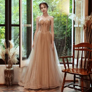 Élégant Champagne Robe De Soirée 2020 Princesse Bretelles Spaghetti Sans Manches Perlage Glitter Tulle Train De Balayage Volants Dos Nu Robe De Ceremonie