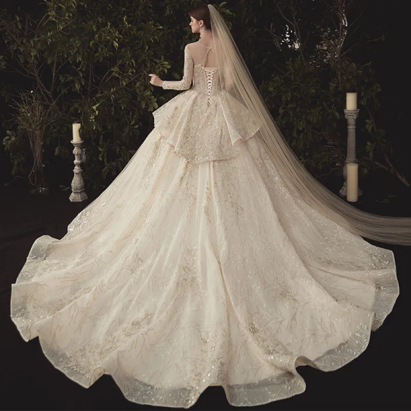 Charming Champagne See-through Wedding Dresses 2020 Ball Gown Scoop Neck Long Sleeve Backless Glitter Appliques Lace Court Train Ruffle
