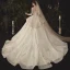 Charming Champagne See-through Wedding Dresses 2020 Ball Gown Scoop Neck Long Sleeve Backless Glitter Appliques Lace Court Train Ruffle