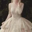 Charming Champagne See-through Wedding Dresses 2020 Ball Gown Scoop Neck Long Sleeve Backless Glitter Appliques Lace Court Train Ruffle