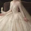 Charming Champagne See-through Wedding Dresses 2020 Ball Gown Scoop Neck Long Sleeve Backless Glitter Appliques Lace Court Train Ruffle