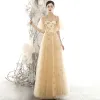 Chic / Beautiful Gold See-through Evening Dresses  2020 A-Line / Princess High Neck Puffy Short Sleeve Glitter Appliques Star Floor-Length / Long Ruffle Backless Formal Dresses