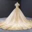 Luxury / Gorgeous Gold Wedding Dresses 2023 Ball Gown Off-The-Shoulder Short Sleeve Backless Beading Glitter Tulle Cathedral Train Ruffle