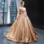 Scintillantes Champagne Paillettes Dansant Robe De Bal 2023 Robe Boule Transparentes Encolure Dégagée Sans Manches Longue Volants Dos Nu Robe De Ceremonie