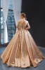 Scintillantes Champagne Paillettes Dansant Robe De Bal 2023 Robe Boule Transparentes Encolure Dégagée Sans Manches Longue Volants Dos Nu Robe De Ceremonie