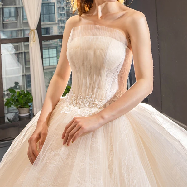 High-end Champagne Bridal Wedding Dresses 2023 Ball Gown Strapless Sleeveless Backless Appliques Lace Cathedral Train Ruffle