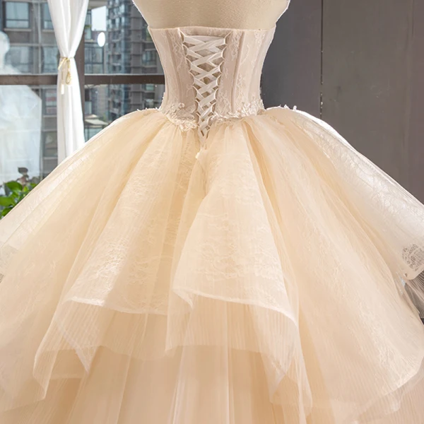 High-end Champagne Bridal Wedding Dresses 2023 Ball Gown Strapless Sleeveless Backless Appliques Lace Cathedral Train Ruffle