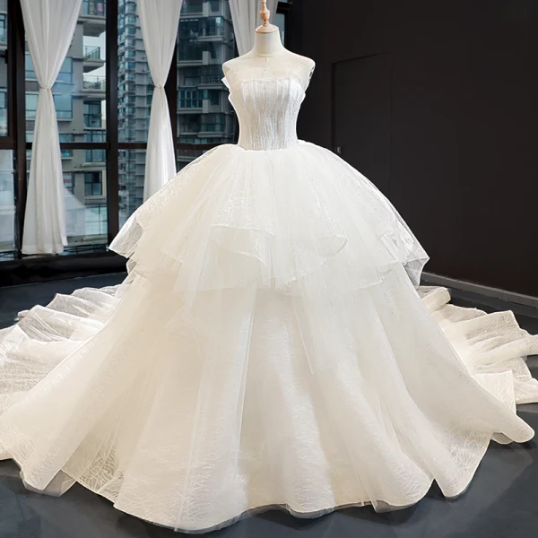 High-end Champagne Bridal Wedding Dresses 2023 Ball Gown Strapless Sleeveless Backless Appliques Lace Cathedral Train Ruffle