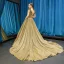 Scintillantes Doré Paillettes Robe De Soirée 2023 Princesse V-Cou Sans Manches Tribunal Train Volants Dos Nu Robe De Ceremonie