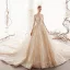 Betoverend Champagne Doorzichtige Trouwjurken 2019 Prinses Ronde Hals Lange Mouwen Handgemaakt Kralen Glans Tule Cathedral Train