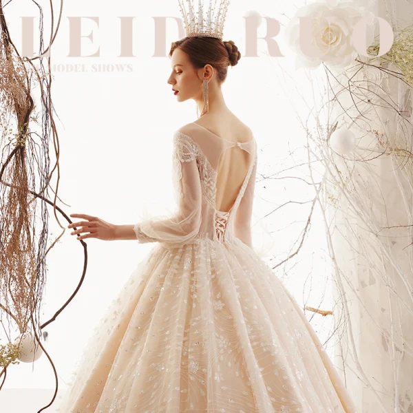Illusion Champagne Transparentes Robe De Mariée 2019 Princesse Encolure Dégagée Gonflée 3/4 Manches Dos Nu Glitter Tulle Appliques En Dentelle Perlage Royal Train