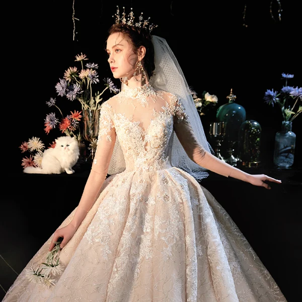 Fabuleux Champagne Transparentes Robe De Mariée 2019 Robe Boule Col Haut 3/4 Manches Dos Nu Appliques En Dentelle Perlage Glitter Tulle Cathedral Train Volants