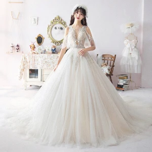 Illusion Ivory Wedding Dresses 2019 A Line Princess See Through Deep V Neck Backless 1 2 Sleeves Appliques Lace Beading Chapel Train Ruffle Spring
