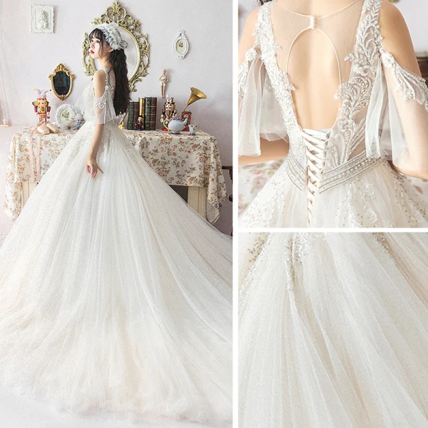 Illusion Ivoire Robe De Mariée 2019 Princesse Transparentes Col v profond Dos Nu 1/2 Manches Appliques En Dentelle Perlage Chapel Train Volants Printemps