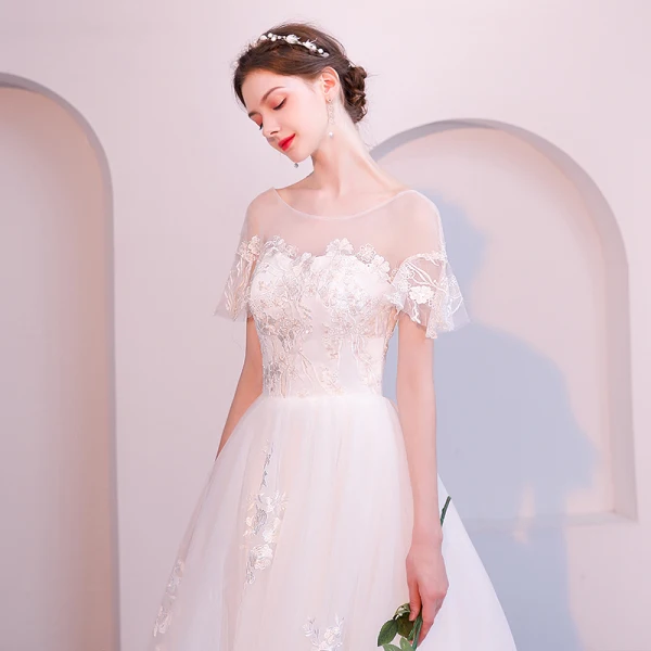 Abordable Ivoire Transparentes Robe De Mariée 2019 Princesse Encolure Dégagée Manches Courtes Dos Nu Appliques En Dentelle Tribunal Train