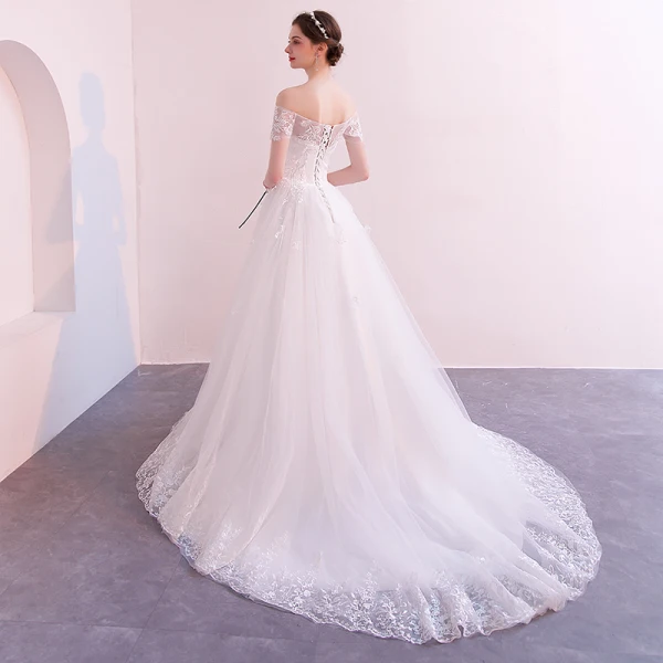 Abordable Ivoire Transparentes Robe De Mariée 2019 Princesse De l'épaule Manches Courtes Dos Nu Appliques En Dentelle Tribunal Train Volants