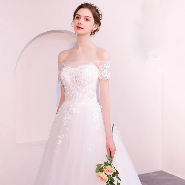 Abordable Ivoire Transparentes Robe De Mariée 2019 Princesse De l'épaule Manches Courtes Dos Nu Appliques En Dentelle Tribunal Train Volants