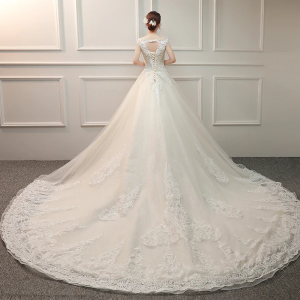 Élégant Ivoire Robe De Mariée 2019 Princesse V-Cou Sans Manches Dos Nu Appliques En Dentelle Perlage Glitter Tulle Volants Chapel Train