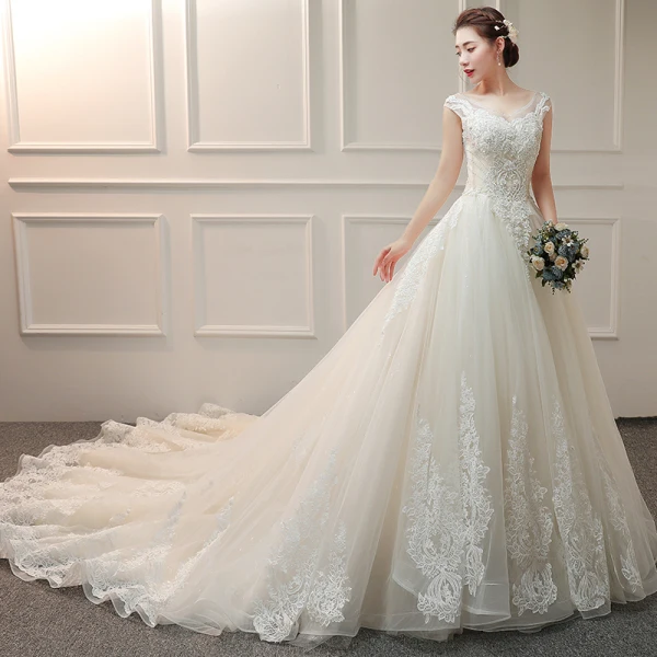Élégant Ivoire Robe De Mariée 2019 Princesse V-Cou Sans Manches Dos Nu Appliques En Dentelle Perlage Glitter Tulle Volants Chapel Train