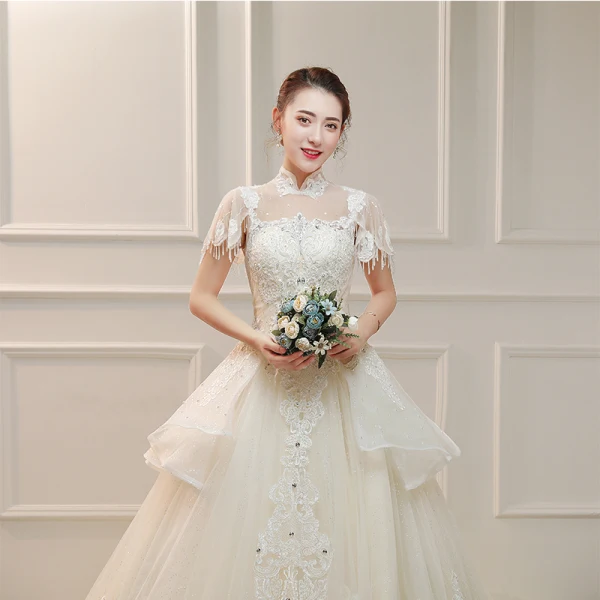 Vintage / Originale Ivoire Transparentes Robe De Mariée 2019 Princesse Col Haut Manches Courtes Dos Nu Appliques En Dentelle Perlage Gland Perle Faux Diamant Cathedral Train