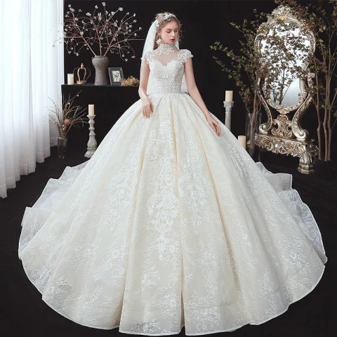 Vintage Champán Transparentes Boda Vestidos De Novia 2020 Ball Gown Cuello Alto Sin Mangas Apliques Con Encaje Rebordear Perla Chapel Train Ruffle