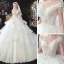 Romantisch Ivory / Creme Hochzeits Brautkleider / Hochzeitskleider 2020 Ballkleid Durchsichtige Rundhalsausschnitt Kurze Ärmel Rückenfreies Applikationen Spitze Perlenstickerei Quaste Kathedrale Schleppe Fallende Rüsche