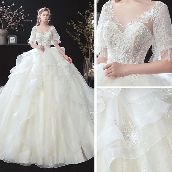 Style Victorien Ivoire Transparentes La Mariée Robe De Mariée 2020 V-Cou Robe Boule Gonflée 1/2 Manches Dos Nu Appliques En Dentelle Perlage Cathedral Train Volants