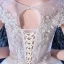 Illusion Ivoire Transparentes La Mariée Robe De Mariée 2020 Princesse Encolure Dégagée Manches Courtes Dos Nu Glitter Tulle Appliques Fleur Perlage Cathedral Train Volants