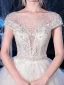 Illusion Ivoire Transparentes La Mariée Robe De Mariée 2020 Princesse Encolure Dégagée Manches Courtes Dos Nu Glitter Tulle Appliques Fleur Perlage Cathedral Train Volants