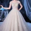 Illusion Ivoire Transparentes La Mariée Robe De Mariée 2020 Princesse Encolure Dégagée Manches Courtes Dos Nu Glitter Tulle Appliques Fleur Perlage Cathedral Train Volants
