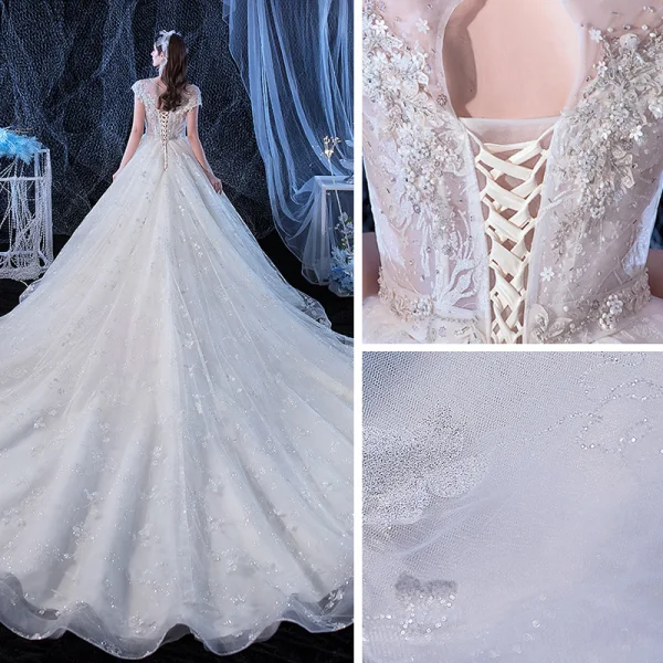 Illusion Ivoire Transparentes La Mariée Robe De Mariée 2020 Princesse Encolure Dégagée Manches Courtes Dos Nu Glitter Tulle Appliques Fleur Perlage Cathedral Train Volants