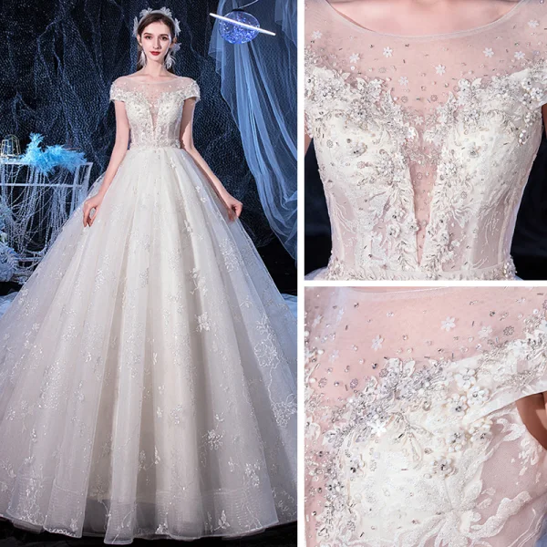 Illusion Ivoire Transparentes La Mariée Robe De Mariée 2020 Princesse Encolure Dégagée Manches Courtes Dos Nu Glitter Tulle Appliques Fleur Perlage Cathedral Train Volants