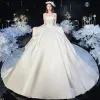 Modest / Simple Ivory Satin Bridal Wedding Dresses 2020 Ball Gown Off-The-Shoulder Short Sleeve Backless Cathedral Train Ruffle
