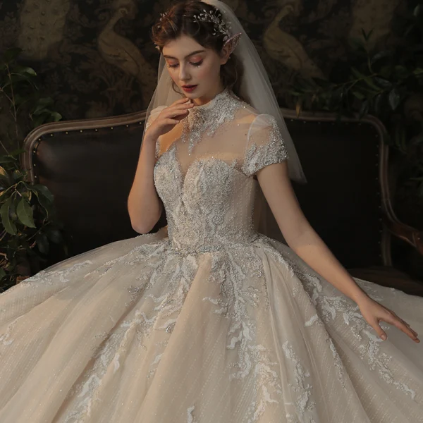 Luxury / Gorgeous Champagne See-through Bridal Wedding Dresses 2020 Ball Gown High Neck Short Sleeve Backless Appliques Lace Handmade  Beading Glitter Tulle Cathedral Train
