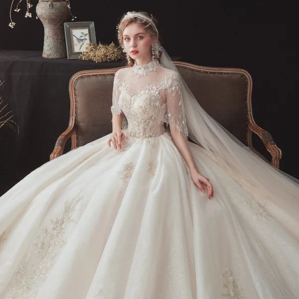 Vintage / Retro Champagne See-through Bridal Wedding Dresses With Shawl 2020 Ball Gown High Neck Sleeveless Backless Glitter Tulle Flower Appliques Lace Beading Cathedral Train Ruffle