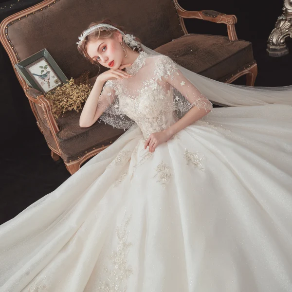 Vintage / Retro Champagne See-through Bridal Wedding Dresses With Shawl 2020 Ball Gown High Neck Sleeveless Backless Glitter Tulle Flower Appliques Lace Beading Cathedral Train Ruffle